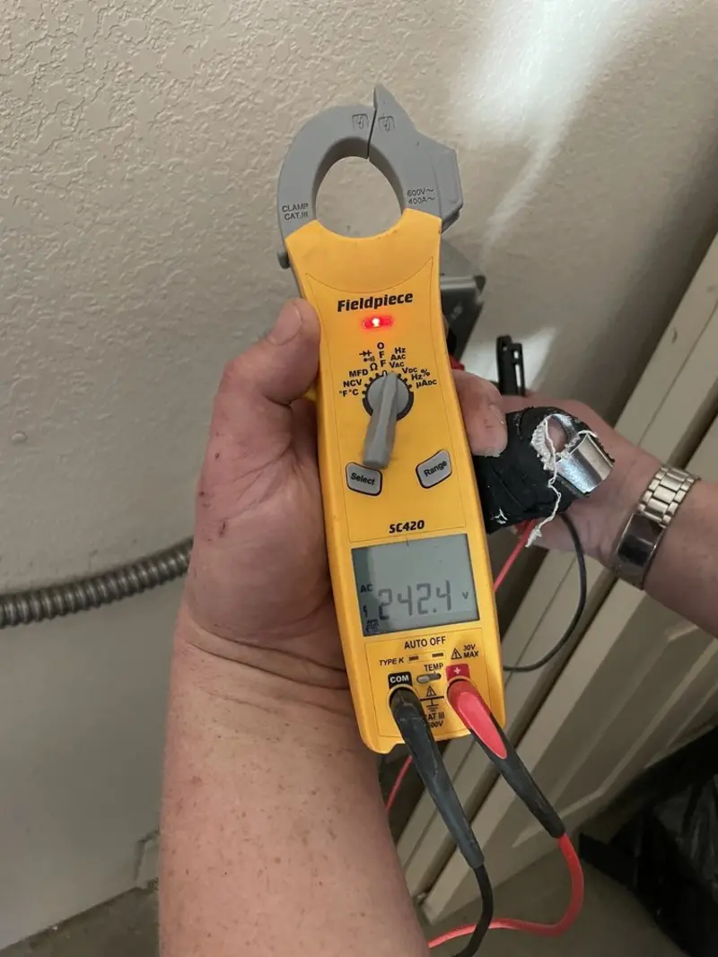 Voltage testing with clamp meter during Whole House Surge Protector in Neshannock